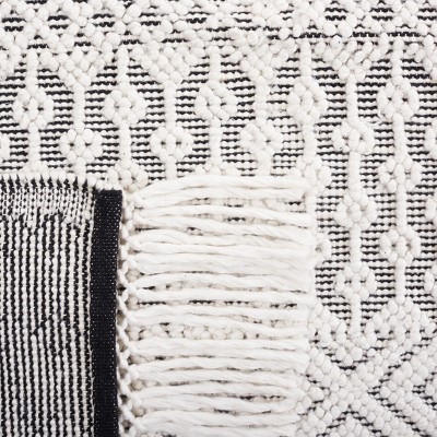 Handmade Black and Ivory Round Tufted Shag Rug