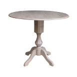 Kayden Round Dual Drop Leaf Pedestal Table Washed Gray Taupe - International Concepts