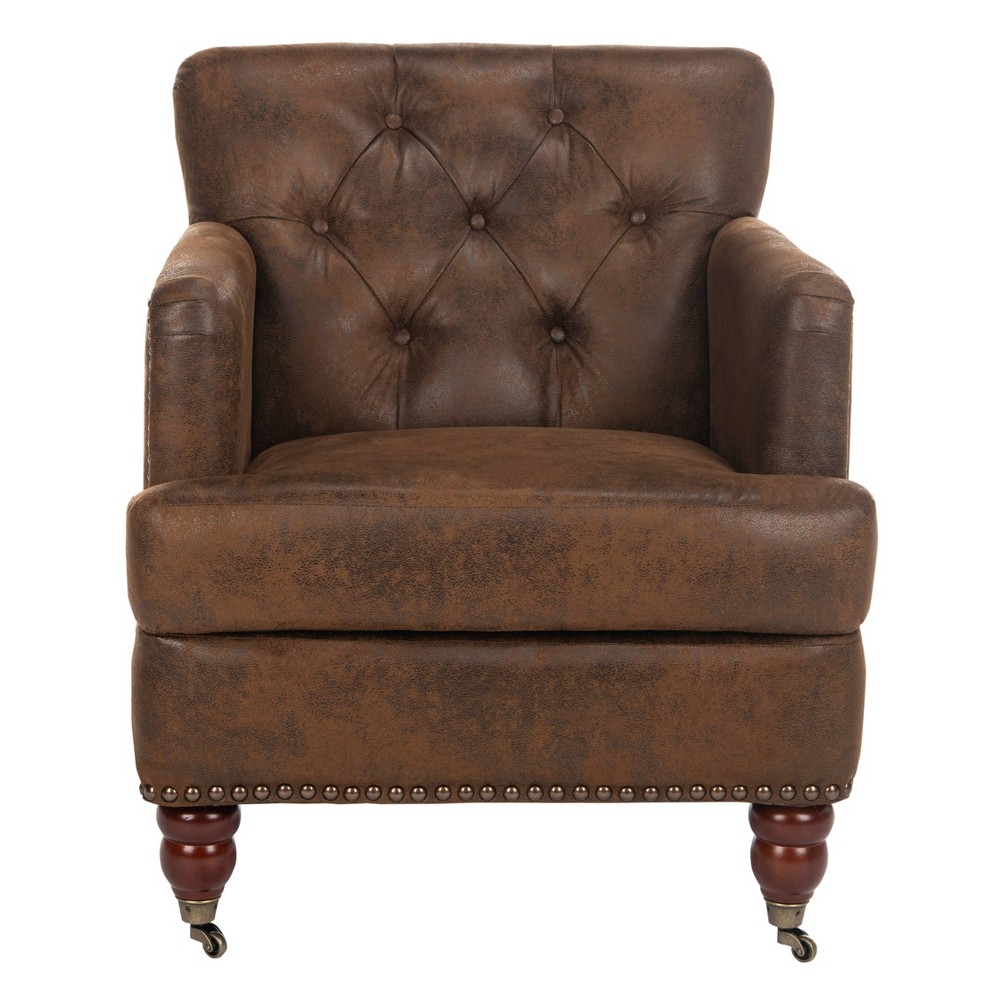 Colin Tufted Club Chair with Casters - Caramel Brown Leather - Safavieh Evoking classic elegance, the Colin club chair in linen upholstery is a timeless design that complements traditional and transitional furnishings. Inviting in the living room and cozy in the bedroom, Colin is crafted with plush seat cushion, and designer details from button tufting to silver or brass nail head trim and birch wood legs finished in cherry mahogany. The Colin chair has front casters to allow for easy mobility. This sturdy chair can hold up to two hundred and seventy five pounds. Color: Brown. Pattern: Solid.