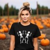 Simply Sage Market Women's Two Dancing Skeletons Short Sleeve Graphic Tee - 2 of 4