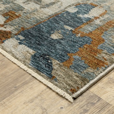 6.7x9.6 Blue and Beige Abstract Synthetic Area Rug