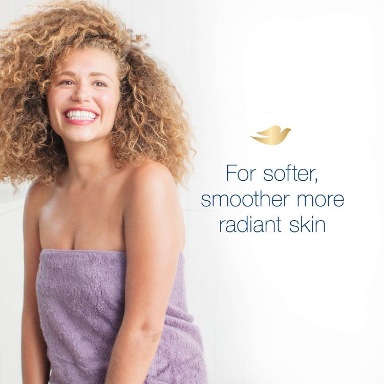 Text reads: "For softer, smoother more radiant skin." A woman with curly hair wrapped in a purple towel stands against a white background. Dove logo in gold. 