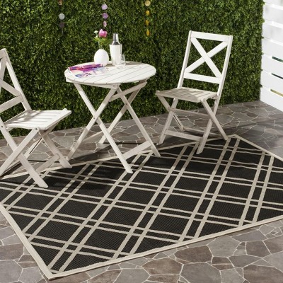 Safavieh Courtyard 5'3" x 7'7" Black and Beige Synthetic Area Rug