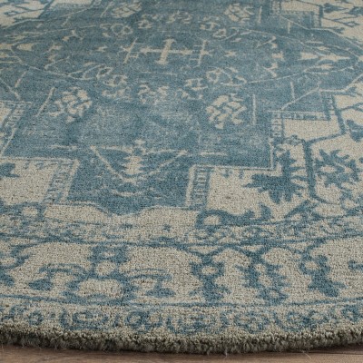 Ivory and Turquoise Round Tufted Wool Area Rug