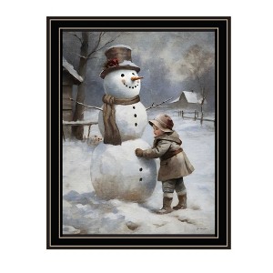 HomeRoots Boy Building A Snowman Black Framed Wall Art - 1 of 4