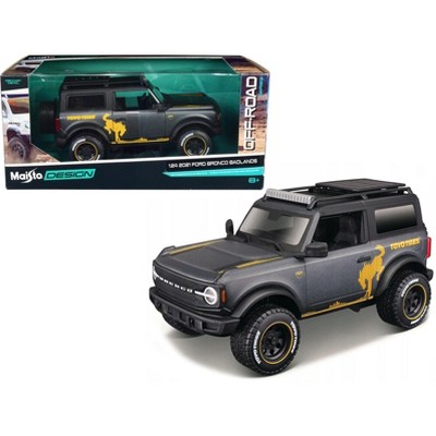2021 Ford Bronco Badlands Dark Gray Metallic with Gold Graphics and Roof Rack "Off-Road" 1/24 Diecast Model Car by Maisto