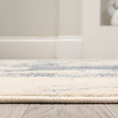 Blue and Cream Abstract 8' x 10' Synthetic Area Rug