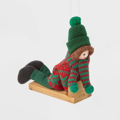 Kid Sledding with Green Hat Christmas Tree Ornament - Wondershop™