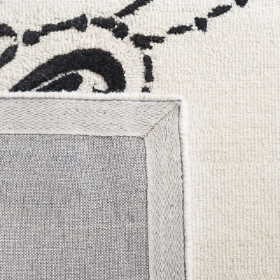 Ivory and Black Floral Tufted Wool 4' x 6' Rug