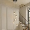 ALOADECOR 12'' 5-Light Modern Clear Ripple Glass Staircase Chandelier Globe Bubble Textured Glass Pendant In Matte Black For Foyer Entryway - 2 of 4