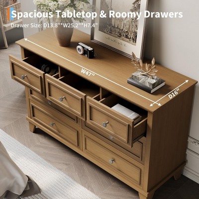 Top-down view of a wooden dresser with many small drawers