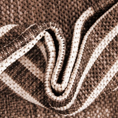 5' x 8' Brown and Ivory Geometric Synthetic Outdoor Rug