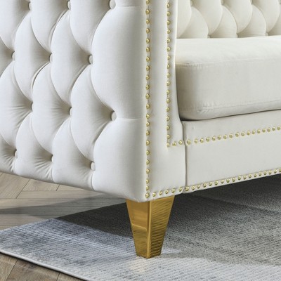 Close-up of gold-tone studded trim and wood leg