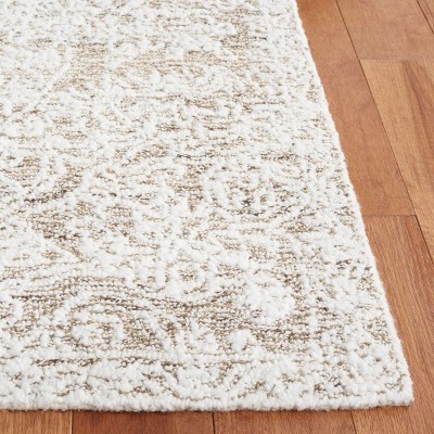 Ivory Hand-Tufted Wool and Synthetic 4' x 6' Area Rug