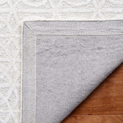 Beige and Ivory Tufted Wool and Viscose 6' x 9' Area Rug