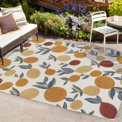 4' x 6' Ivory and Orange Floral Synthetic Area Rug