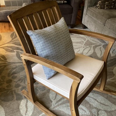 Selma teak finish wood outdoor online rocking chair with cream cushion