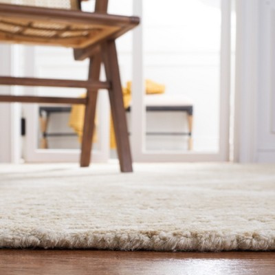 Ivory and Beige Abstract Handmade Wool Tufted Rug, 2' x 3'