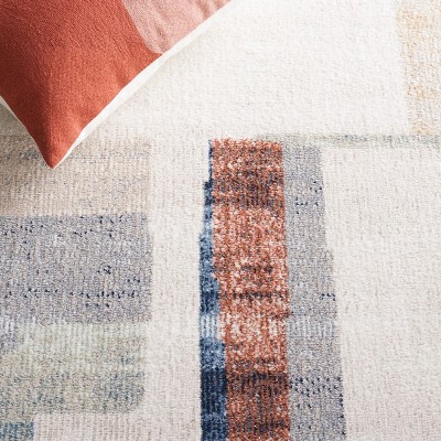 Ivory and Blue Rust Round Synthetic Area Rug, 6'7"