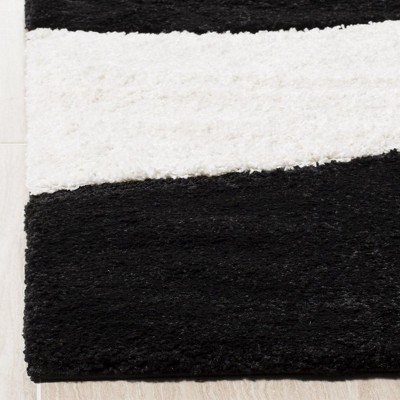 Handmade Tufted Black/Ivory Synthetic Shag Rug, 4x6 Feet