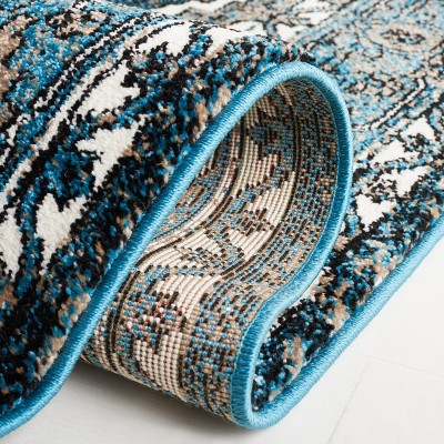 Vintage Blue and Ivory Synthetic 8' x 10' Hand-Knotted Area Rug