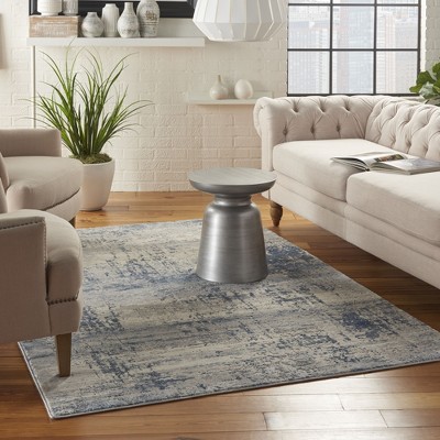 Blue and Ivory Abstract Synthetic Area Rug 5'3" x 7'3"