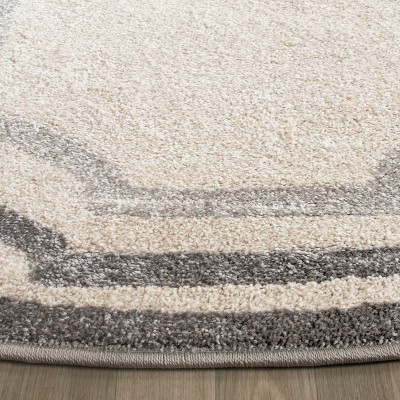 Ivory and Light Grey Round Synthetic Area Rug