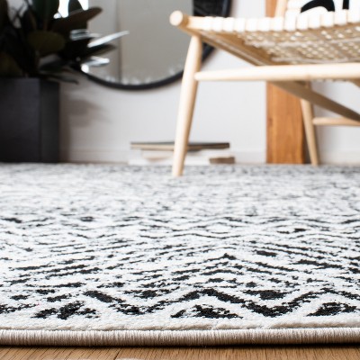 Ivory and Charcoal Geometric 9' x 12' Synthetic Area Rug
