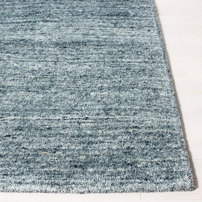 Handmade Himalaya Tufted Blue Wool Rectangular Rug - 5' x 8'