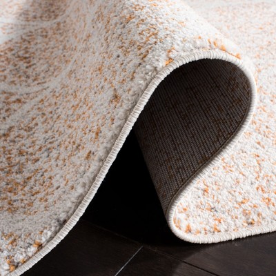 Ivory and Orange Synthetic Stain-Resistant Area Rug 3' x 5'