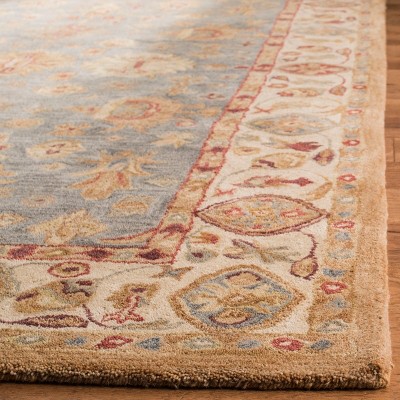 Ivory and Blue Hand Tufted Wool 4' x 6' Area Rug