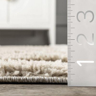 Cordelia Ivory Synthetic 5' x 7'6" Easy-Care Area Rug