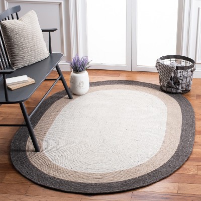 Handwoven Ivory Wool 8' x 10' Oval Braided Reversible Rug