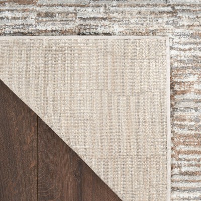 Ivory and Tan Abstract Synthetic Rectangular Rug 5' x 7'