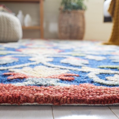 Handmade Blue and Rust Wool Tufted Area Rug 4' x 6'