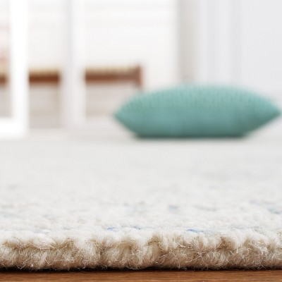 Ivory and Blue Handmade Wool Abstract Tufted Area Rug, 8' x 10'