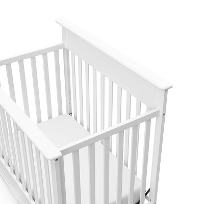 White 4-in-1 Convertible Mini Crib with Mattress