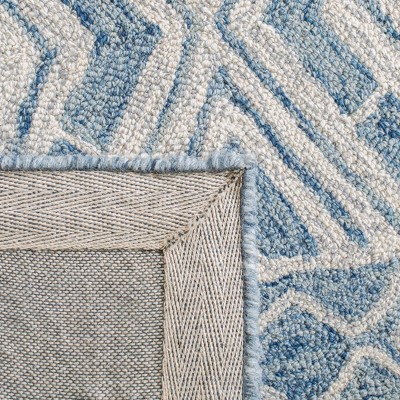 Blue and Ivory Handmade Wool Tufted Area Rug, 5' x 8'