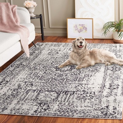 Ivory and Black Reversible Easy-Care Synthetic Area Rug - 6'7" x 9'