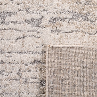 Ivory and Taupe Abstract High Pile Area Rug 4' x 6'