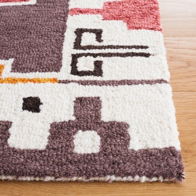 Rodeo Drive 6' x 9' Black and Rust Hand-Tufted Wool Area Rug