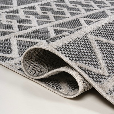 Aylan Black/Ivory Geometric High-Low Pile Synthetic Indoor/Outdoor Rug