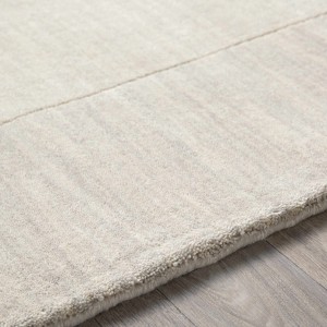Hauteloom Bordered Solid Beige Cream Wool Rug - 1 of 4