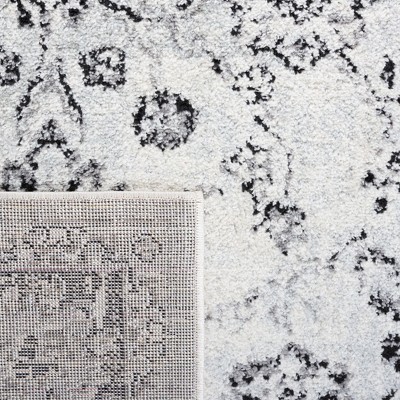 Ivory and Black Synthetic Round Area Rug