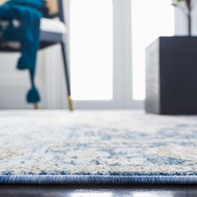 Ivory and Blue Rectangular Oriental Synthetic Area Rug 8' x 10'