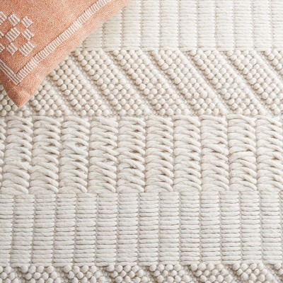 Ivory Handmade Wool Tufted 6' x 9' Area Rug