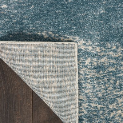 Ivory and Teal Abstract Flat Woven Synthetic Rug, 5' x 7'