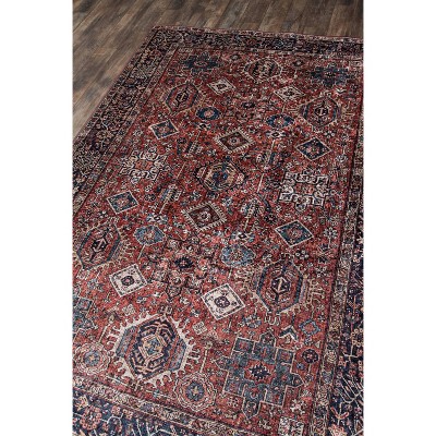 6' x 9' Rust and Blue Synthetic Traditional Area Rug