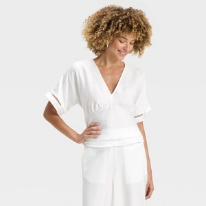 Women's Dolman Sleeve Ladder Stitch V-Neck Blouse - A New Day™ - 1 of 3