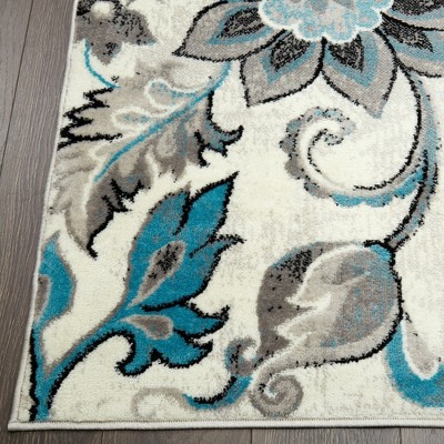 Ivory Floral Tufted 64" Synthetic Easy-Care Area Rug